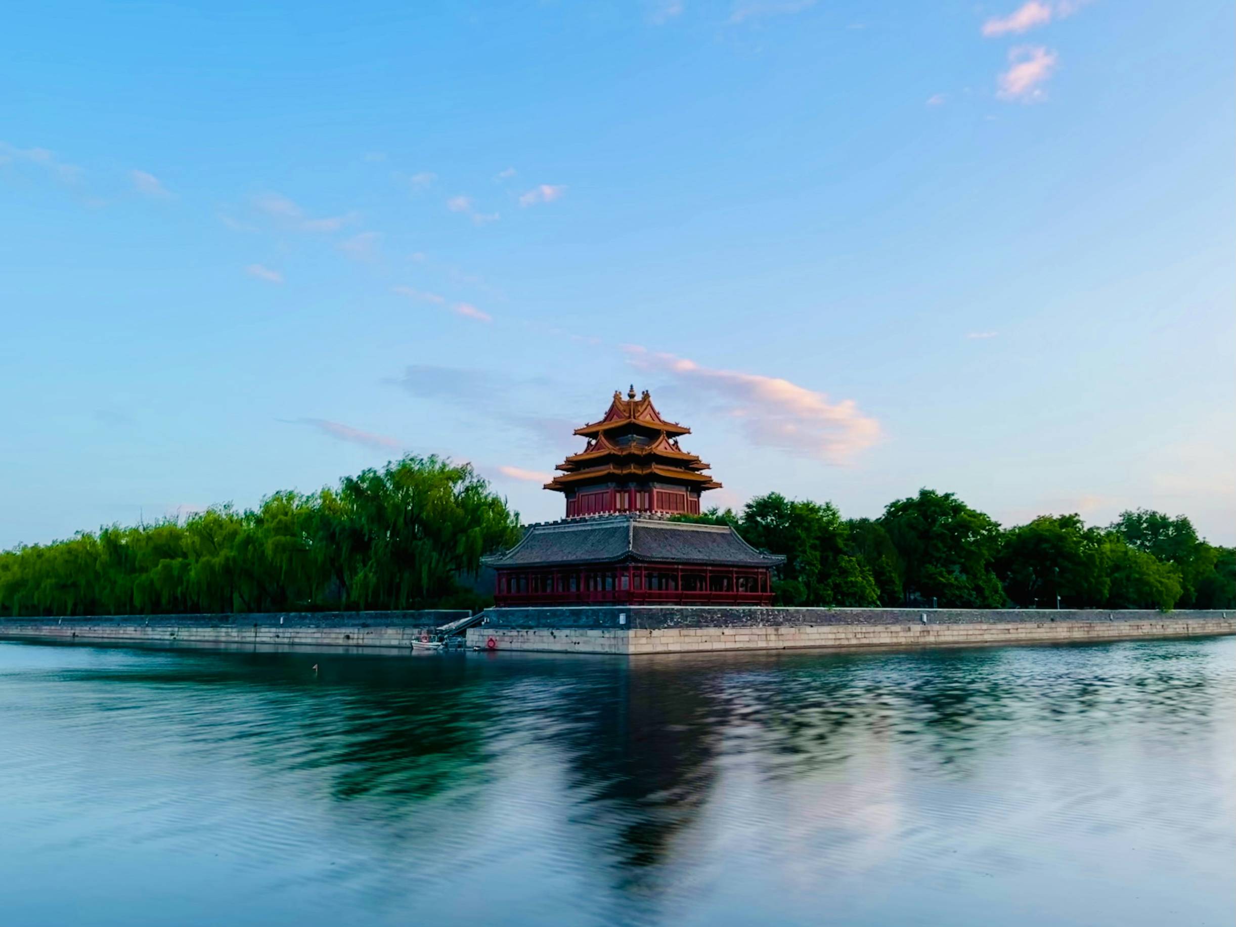 A large body of water with a building in the background