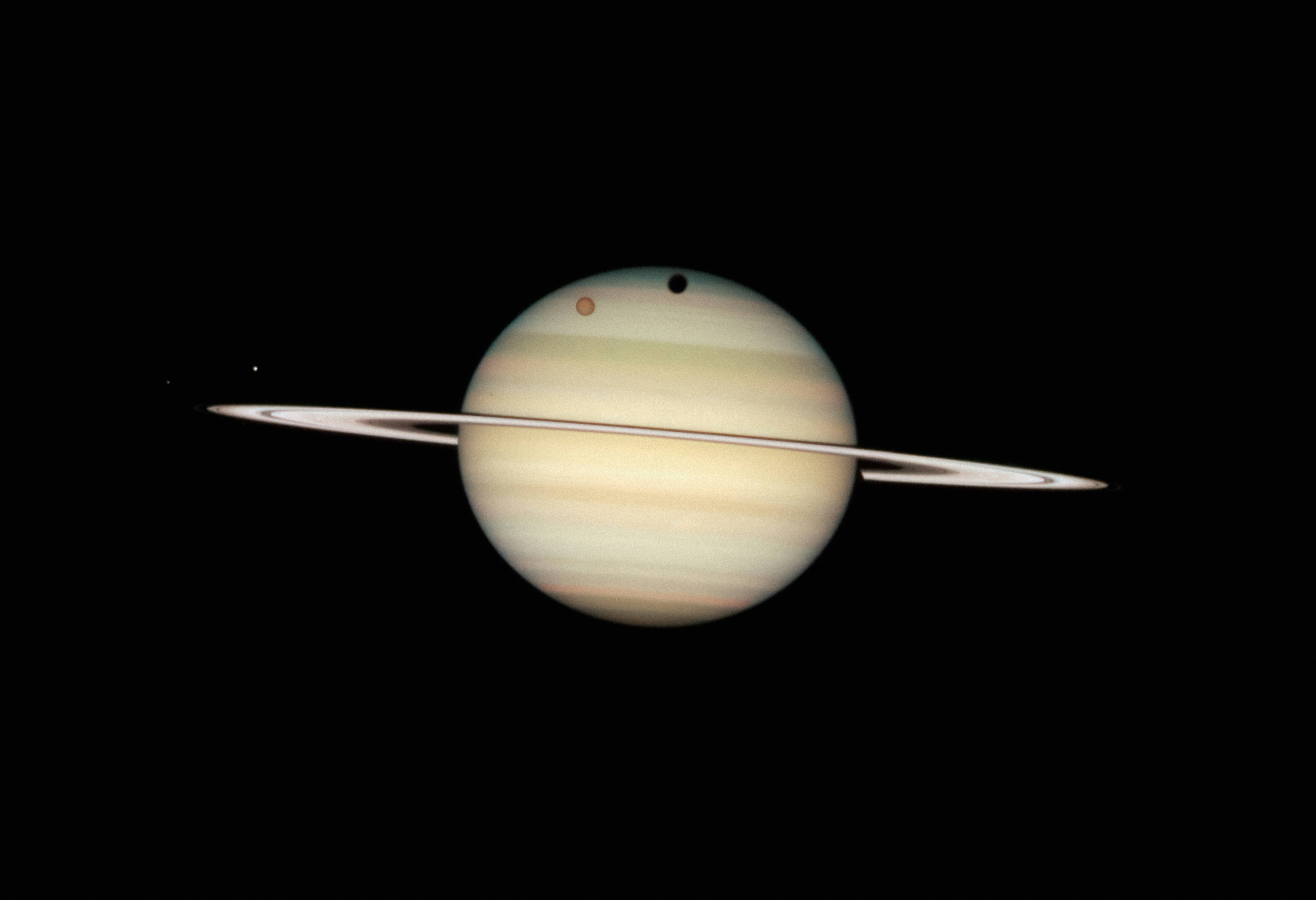 saturn and its rings in the dark sky