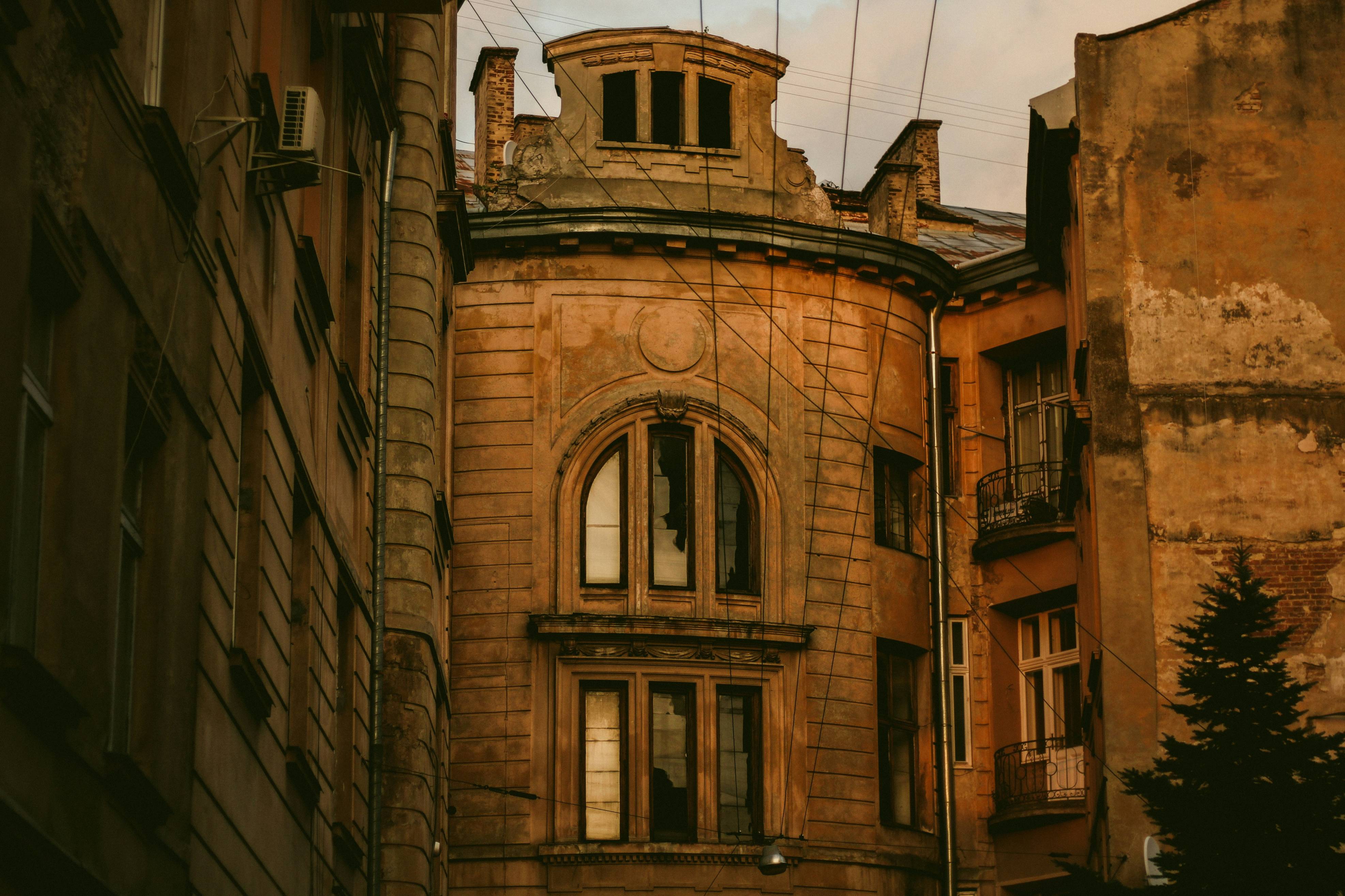 An old building with a clock on the top of it