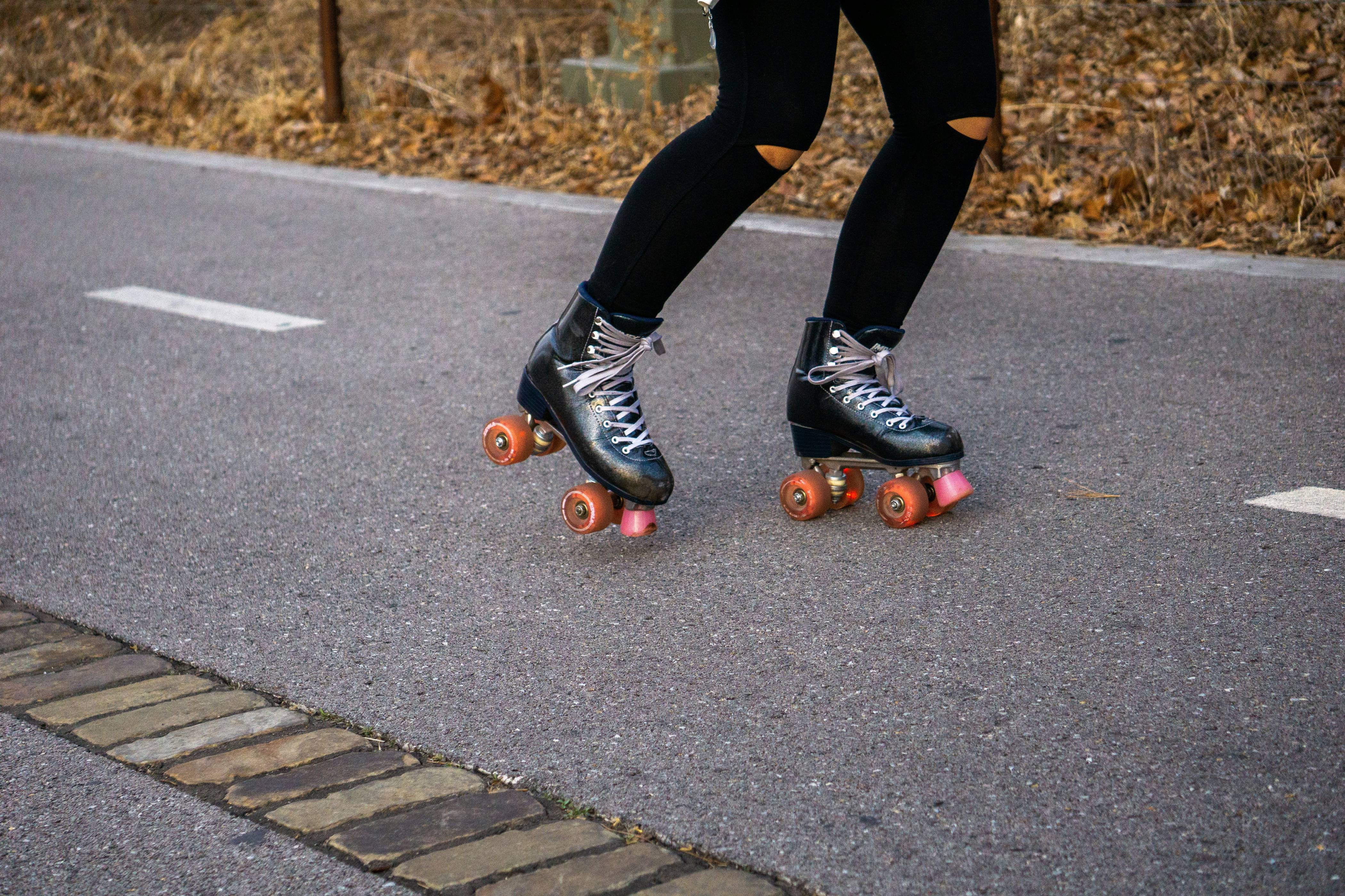 a person riding a skateboard down a street