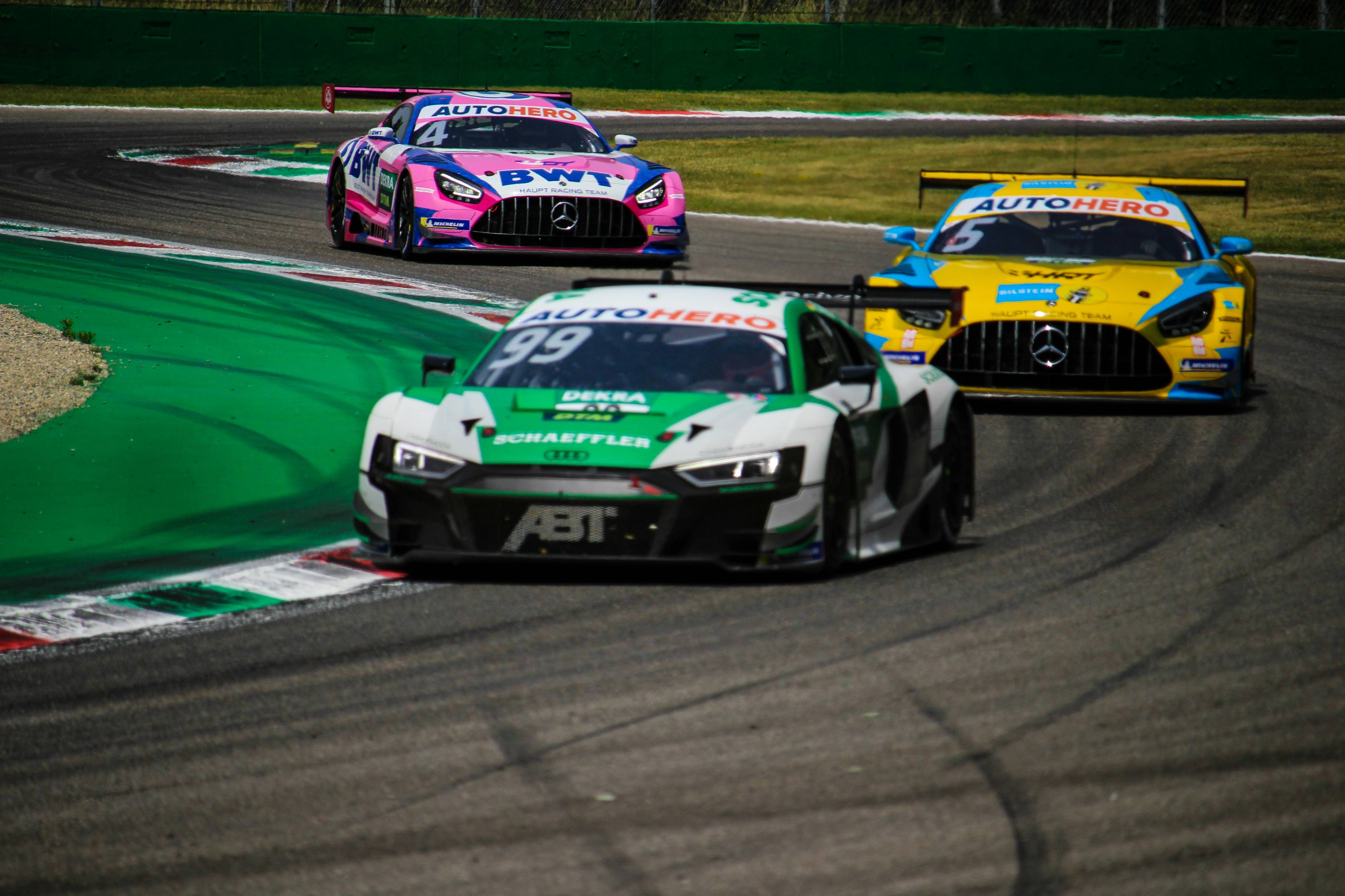green and white racing car on track